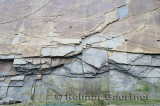 Abstract pattern of vertical layers of stone at Cape Enrage New Brunswick cliff face