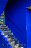 Stairs and door with blue and yellow at the Islamic Art Museum of Marrakech at Majorelle Garden Morocco