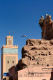 Minaret of Kasbah Mosque with flying and nesting White Storks in Medina ruin of Marrakech