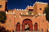 Front of Hotel Kasbah Lamrani berber architecture style of red adobe fortress Morocco