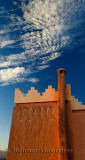 Texture and pattern of Berber pise architecture with chimney at sunrise in Tinerhir Morocco