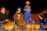 Campfire drumming circle at Berber tent camp in the Erg Chebbi desert Morocco