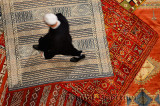 Morrocan Riad owner shopping for a new persian rug in Fes el Bali Medina Morocco