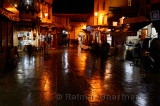 Cafes at Bab Boujeloud Blue Gate on a wet night in Fes el Bali Medina Morocco