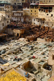 White liming chrome vats and brown tanning pits in Chouara quarter Fes Tannery Morocco
