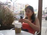 a rare shot of tina texting. hah. (with the dope D500 and vanilla latte.. nonfat milk)