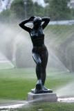 Statue pleased by shower