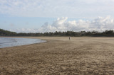 Sharing the beach with a jogger