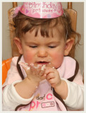 Enjoying her birthday cupcake