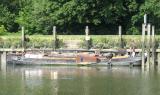 Old barge enters the lock.