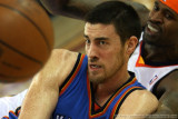 Oklahoma City Thunders Nick Collison pitches the loose ball away from Golden State Warriors Stephen Jackson