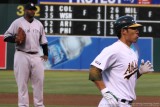 New York Yankees pitcher C.C. Sabathia looks a Oakland As catcher Kurt Suzuki after he hit a homerun