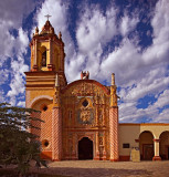 San Miguel Concá against a dramatic sky.