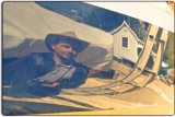 Sam Pictured in the Reflection of a Boat Hull