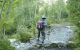 Kathy deals with some water flowing over the trail.