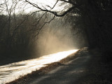 The sun falls on on the ice-covered canal