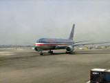 American Airlines 757 through a dirty window