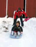 Sleding down the barn hill *