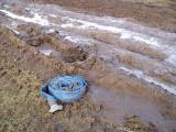 A hose in a field of mud