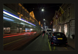 Geneva at night... outgoing tram and cyclist ....
