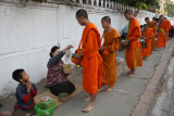 Monks collecting alms