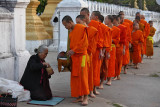 Monks collecting alms