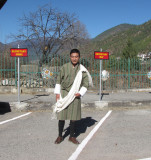 Our Guide Tshering Penjor wearing the Traditional Gho.jpg