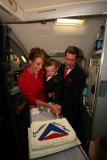 Cutting the wedding cake (served to all passengers on flight)