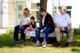 In the shade with Mom and Grandparents