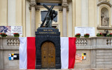 Sculpture With Flags  At Holy Cross Church
