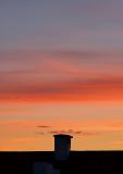 Sunset With A Chimney