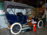 Luxurious early Ford; perhaps 1908 Model T Touring Car.