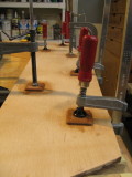 Backing is some thin hardwood, glued on -- eight bolts, all told.