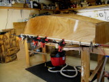 Starboard sheer in clampup.  Hull glass has been filled with 2 coats of resin.