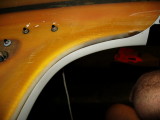 Previous photo was the port underside; this is the starboard.  Eddyline polyester resin and filler had embrittled and failed.