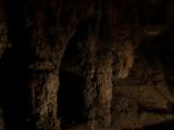 stalactites in lantern light.JPG