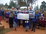 Niamh and Martin presenting the centre with a cheque for 9,000 2009.