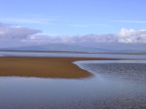 A  sandbank  surfacing  through  the  ebb  tide.