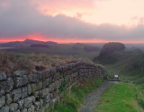 Masked  sunrise  over  Hadrians  Wall.