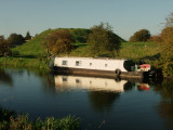 Canal  boat  reflected  on  the  River  Nene.