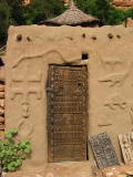 mud house with carvings, dogon country