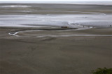 Water, sand and humans in the bay of Mont-Saint-Michel