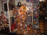 Memorial in church of rescue personel patches. Note British Bobbie hat at top