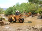 11:58 am. Cleaning the Mud From Silver King Crossing