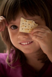 Lorelei playing with her food; peek-a-boo! I see you!