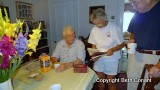 Joe and Priscilla look at old photo albums.