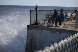 ....watches the waves attack the seawall!