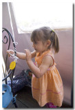 Lorelei stays busy singing Working on the Railroad and tying balloon strings.