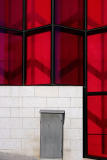 The gray door within the red transparent wall