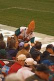 A conehead selling beer